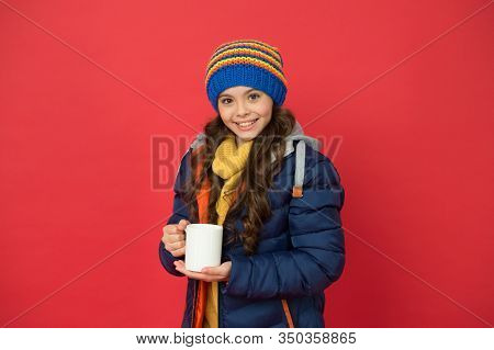 Time To Get Energy. Happy Child Enjoy Hot Drink On Winter Day. Small Girl Hold Tea Or Cocoa Cup Red 