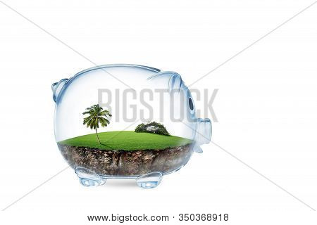 Saving To Buy A Land Or Land Savings Concept With Grass Growing In Shape Of Land Inside Transparent 