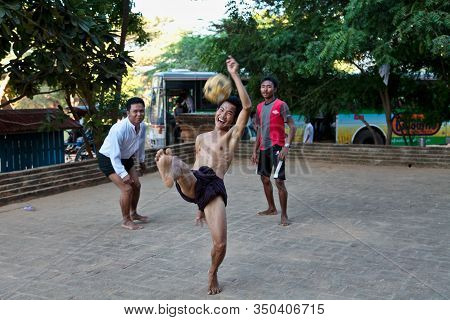 Bagan, Myanmar - Nov 15, 2019: Burmese Men Playing The Traditional Ball Game Of Myanmar: Chinlone.
