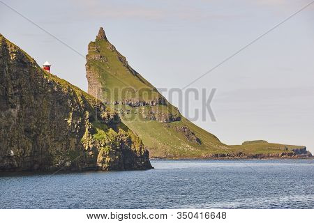 Faroe Islands Sunset Dramatic Coastline Landscape . Vagar Island. Seascape