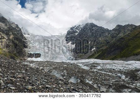 Amazing View To Full Adishi Glacier Icefall And Its Small Waterfall In Mountains Of Svaneti Georgia
