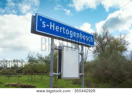 Place Name Sign In The Netherlands With The City 's-hertogenbosch In The Blue Sky