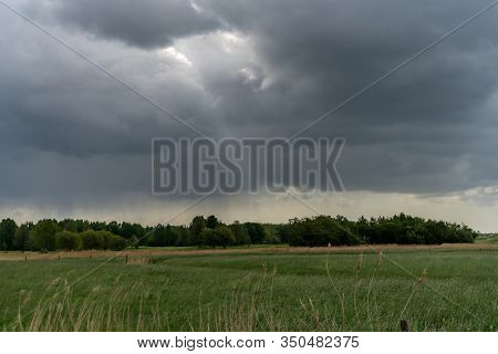 A Small Beam Of Light Through Some Dark Clouds