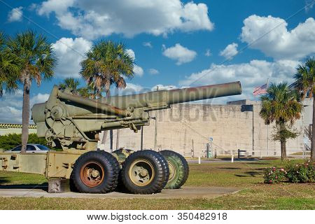 An Old Howitzer Cannon Outside A Coatal Fort