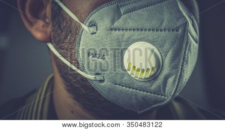 Wearing Mask To Protect Pm 2.5 Dust And Air Pollution. Close Up Of Thai Man Wearing Protection Mask 