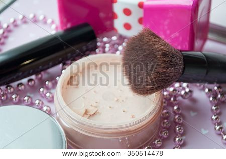 Friable Powder And Brush, Lipstick On A Pink Texture Background