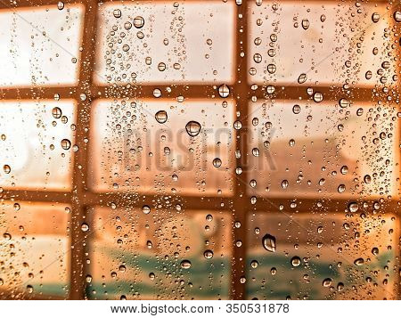 Water Droplets On Window In Car Wash On Sunny Day In Brown Tone