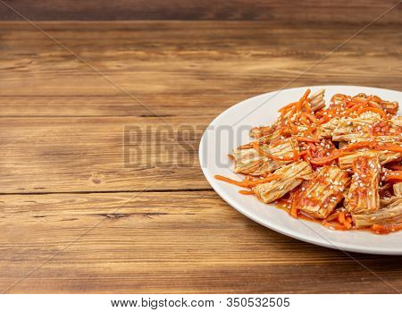Spicy Chinese Or Korean Yuba Tofu Bamboo And Carrots Salad On Wooden Background