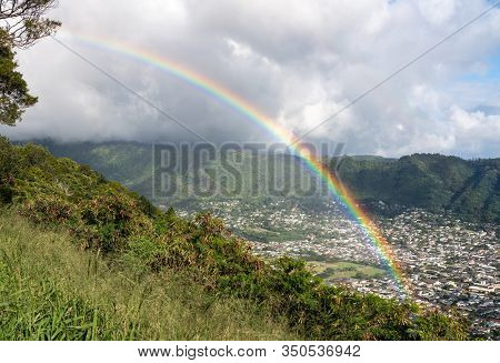 Bright Rainbow Over The Suburbs Of Woodlawn And Manoa In A Valley Above Honolulu On Hawaii