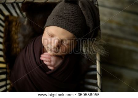 Newborn Baby Sleaping In A Basket