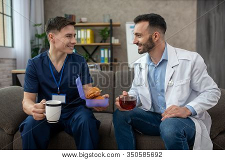 Two Doctors Having Breakfast During The Changeover
