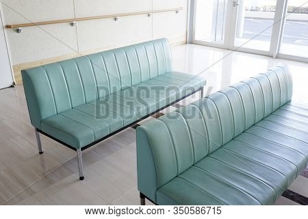 Hospital Waiting Room With Empty Green Chairs