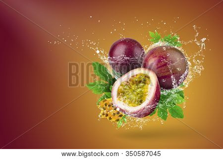 Water Splashing Of Passion Fruit On Red Background.