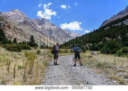 Turkey, Chamard - August 3, 2019: Tourists Stand On The Road Through The Mountain Landscape In The T