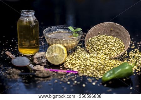 Close Up Of Mung Dal Soup In Glass Bowl Along With Entire Constituents With It Which Are Mung Bean,g