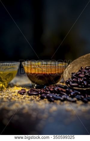 Home Pore Remedy On The Black Glossy Surface Consisting Of Some Red Beans Or Kidney Beans Mung Beans