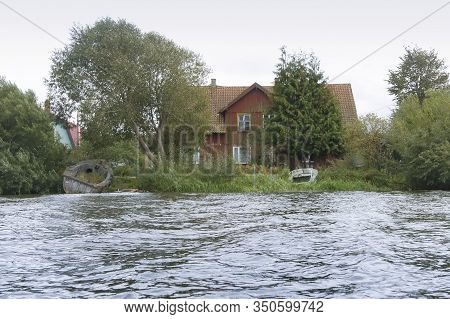 Old House On The Shore, Broken Boat On The Shore, Matrosovka River, Polessky District, Kaliningrad R