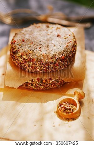 lamb burgers spiced by mint and lamb rub on wooded board