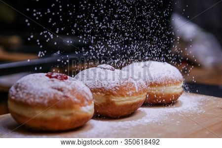 Hanukkah Food Doughnuts With Jelly And Sugar Powder With Bookeh Background. Jewish Holiday Hanukkah