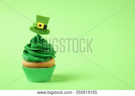 Delicious Decorated Cupcake On Light Green Background, Space For Text. St. Patrick's Day Celebration