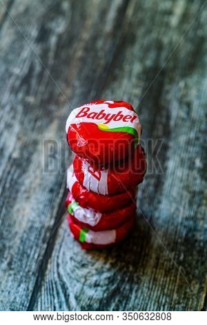 Istanbul, Turkey - February 23, 2018: Mini Babybel Cheese In Red Wax On Wooden Surface.