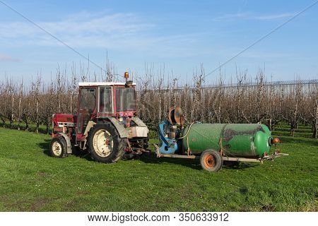 Sint Gillis Waas, Belgium January 16, 2020, Tractor With Dung Cart Ready To Spray The Field With Man