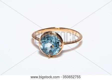 Beautiful Old Golden Ring With Blue Gemstone Isolated On White Background