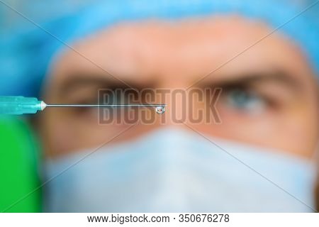 Injection. Coronavirus. Antibiotics. Doctor With Syringe Preparing For Injection. Doctor Makes Vacci