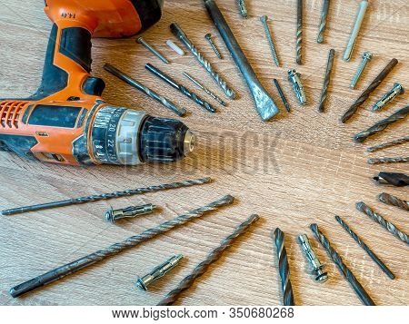 Power Tool On The Wooden Table. Selective Focus. Cordless Screwdriver. Construction Tool. Electric D