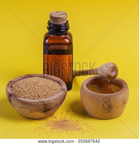 Ingredients For Make Homemade Sugaring Paste. Brown Sugar, Honey And Oil On Yellow Background. Beaut