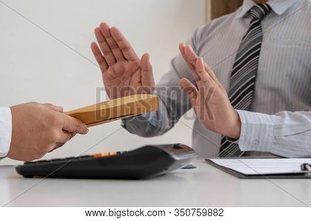 The Businessman Denies The Money In Envelope Proposed By His Partner To Bribe The Concept Of Bribery