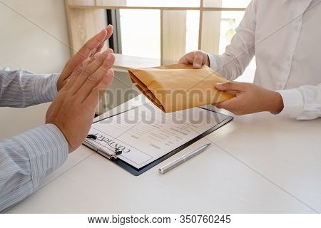 The Businessman Denies The Money In Envelope Proposed By His Partner To Bribe The Concept Of Bribery