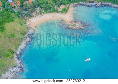 Aerial View Of Beautiful Tropical Beach And Sea With Palm And Other Tree In Phuket Island For Travel
