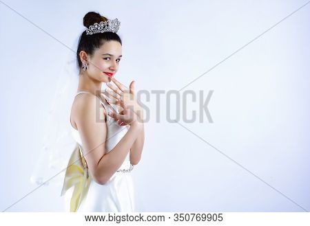 Ring On The Finger Of The Bride, Girl Looks At The Camera And Shows A Hand With A Wedding Ring. Tiar