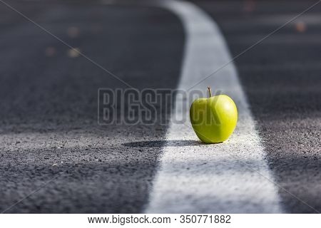 Conceptual Landscape With A Green Apple On The Leading Lines Of The Road,sfanta Ana, Romania
