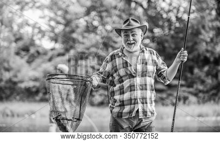Bearded Men Catching Fish. Mature Man With Friend Fishing. Summer Vacation. Happy Cheerful People. M