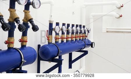 Close Up Of Manometer, Pipes And Faucet Valves Of Heating System In A New White Boiler Room. Boiler 