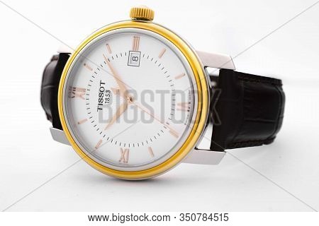 Le Locle, Switzerland 15.01.2020 - Tissot Woman Watch Stainless Steel Case, Gold Pvd Coating White C