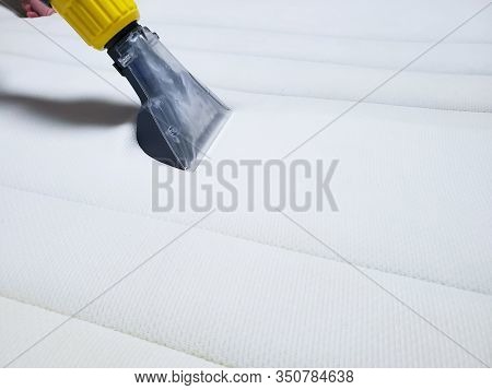 Dry Cleaning Of The White Mattress On The Bed. Wet Cleaning.