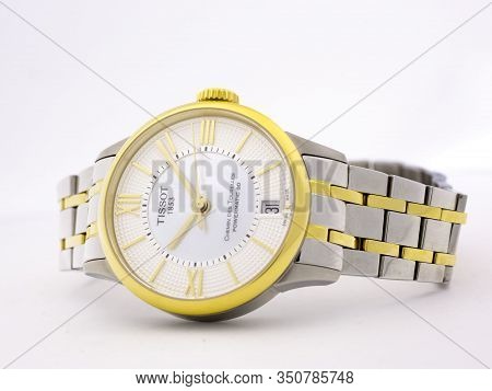 Le Locle, Switzerland 15.01.2020 - Tissot Woman Watch Stainless Steel Case, Gold Pvd Coating White C