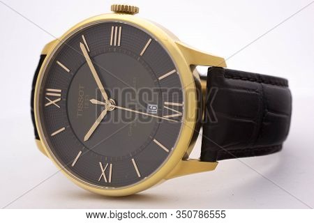 Le Locle, Switzerland 15.01.2020 - Tissot Man Watch Stainless Steel Case, Gold Pvd Coating Black Clo