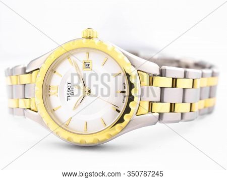 Le Locle, Switzerland 15.01.2020 - Tissot Woman Watch Stainless Steel Case, Gold Pvd Coating White C