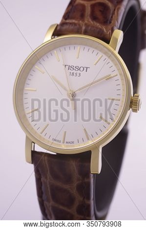 Le Locle, Switzerland 15.01.2020 - Tissot Man Watch Stainless Steel Case, Gold Pvd Coating White Clo