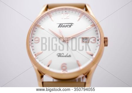 Le Locle, Switzerland 15.01.2020 - Tissot Man Watch Stainless Steel Case, Gold Pvd Coating White Clo