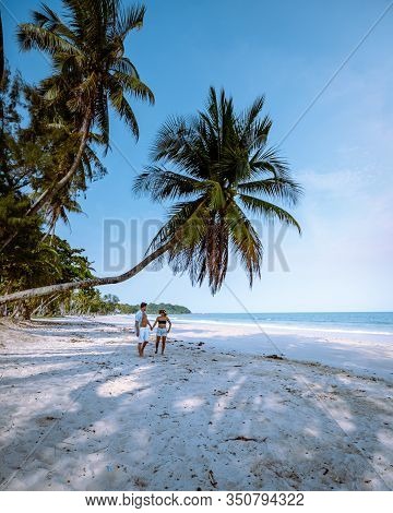 Wua Laen Beach Chumphon Area Thailand, Palm Tree Hanging Over The Beach With Couple On Vacation In T