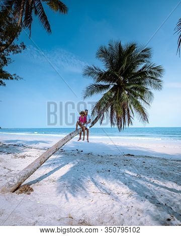 Wua Laen Beach Chumphon Area Thailand, Palm Tree Hanging Over The Beach With Couple On Vacation In T