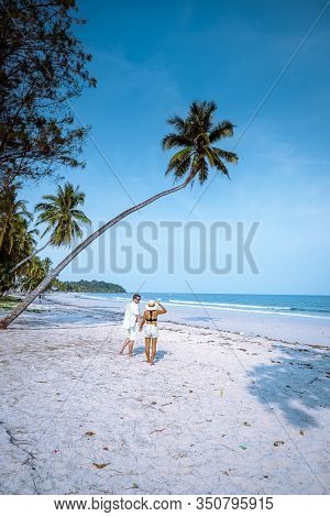Wua Laen Beach Chumphon Area Thailand, Palm Tree Hanging Over The Beach With Couple On Vacation In T