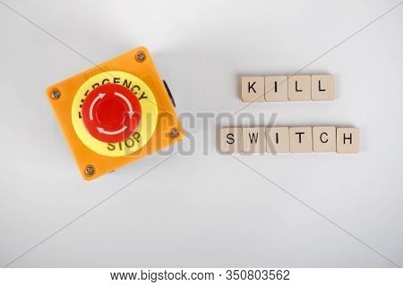 An Industrial Emergency Stop Button With A Sign Reading Kill Switch