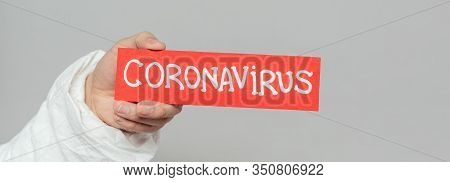 Cropped View Of Epidemiologist Holding Warning Card With Coronavirus Inscription Isolated On Grey, P