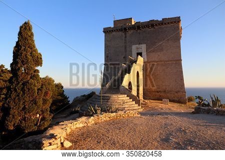 Apulia Sunset View - Porto Selvaggio Defensive Tower Landmark. Italy Coast.